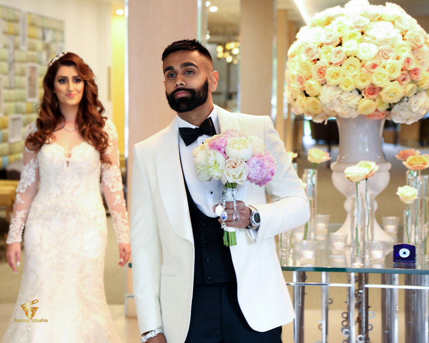 iranian-wedding-photographer-watford-copy 
 Iranian Bride walking to words the groom, he is trying to see her reflaction before he turn around. photographer By Hamid Saboury In London 
 Keywords: Persian wedding Watford The Grove